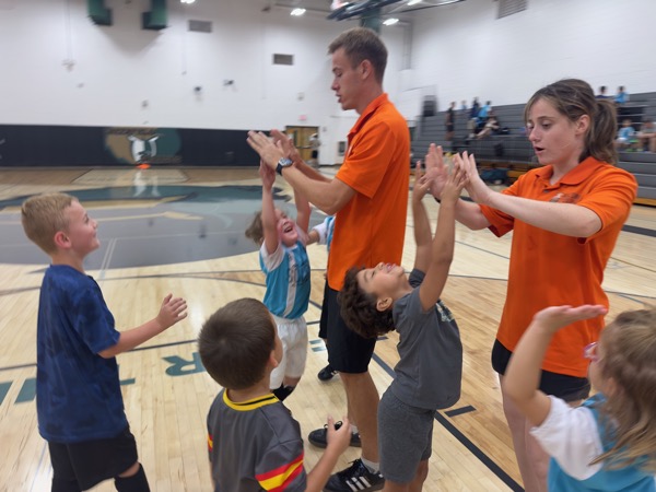 Trainers giving players high fives