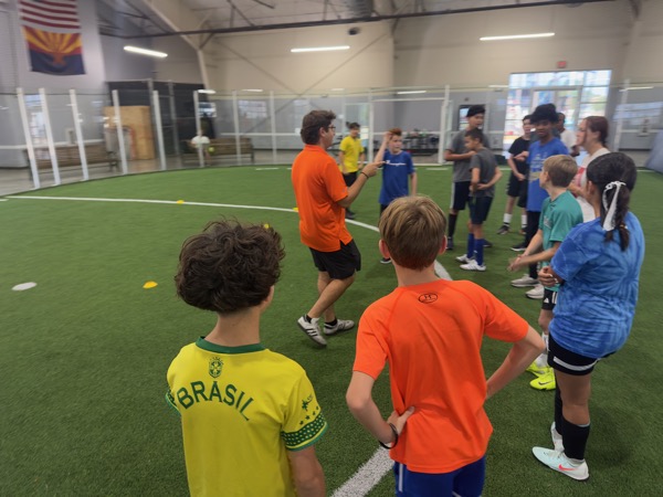 Players watching a trainer show a move