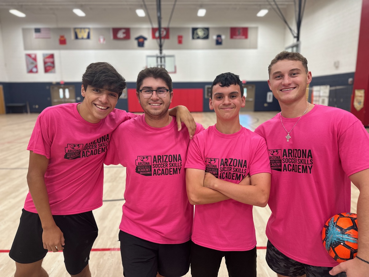 Four AZSSA trainers in pink academy shirts